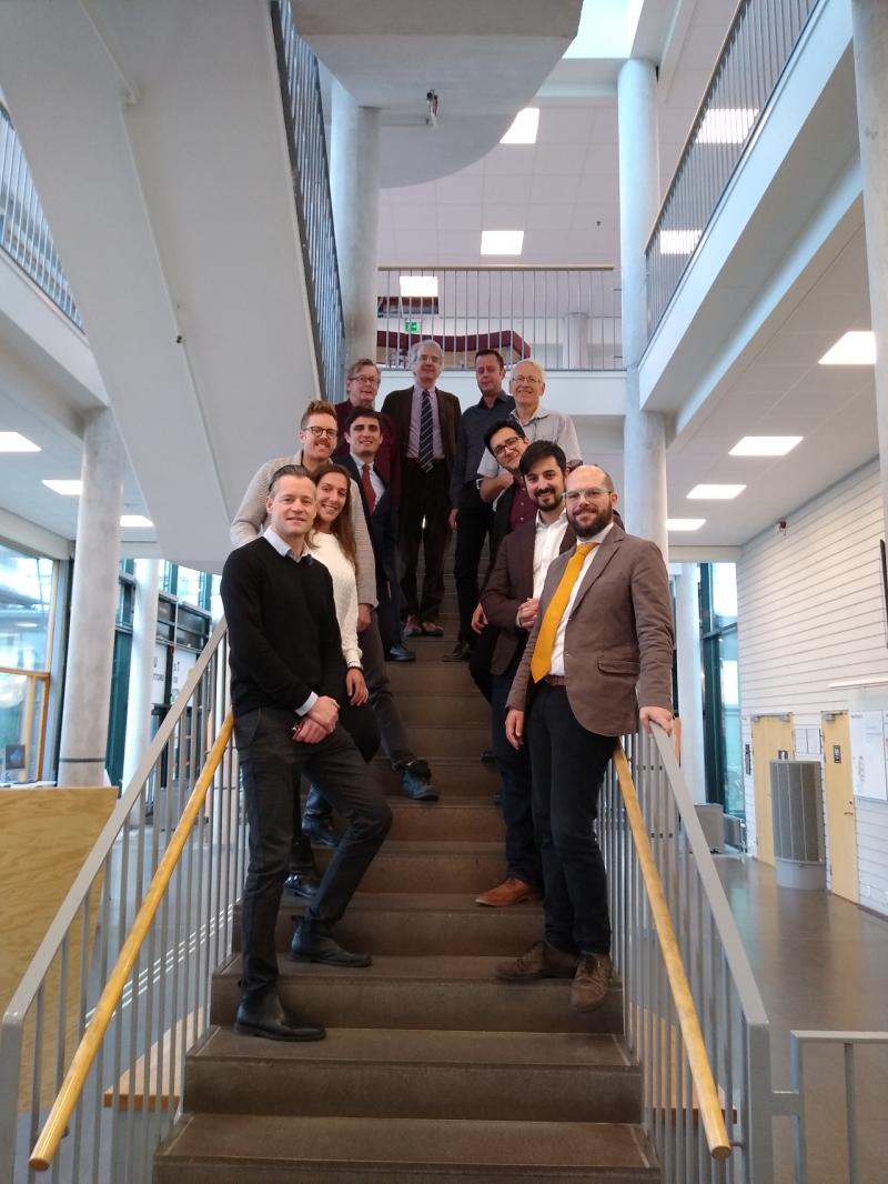 The Distrheat team, 11 researchers standing in a stairway